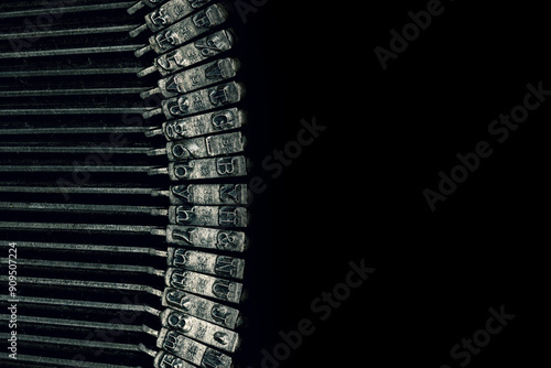 Fotografie Macro photograph of typewriter hammers on a black background with room for copy