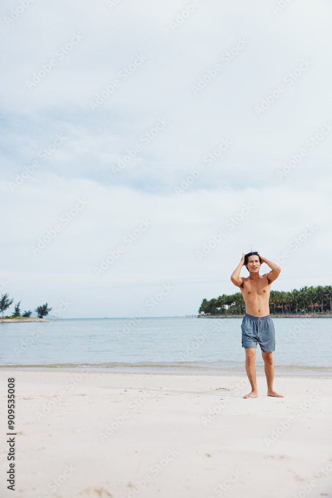 Muscular Asian Athlete Enjoying Beach Run at Sunset: Active Fitness Lifestyle Muscular Asian Athlete Enjoying Beach Run at Sunset: Active Fitness Lifestyle