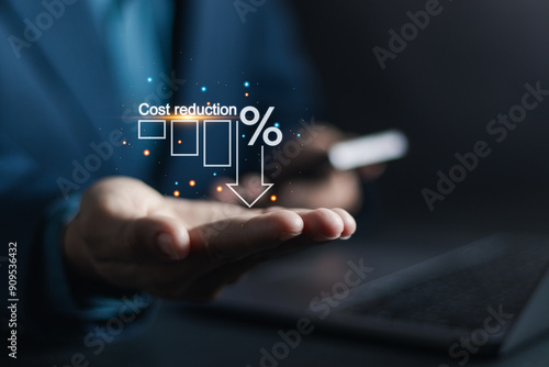 Cost reduction business finance concept, budget management and cost management. Businessman show Cost reduction graph with down arrow on virtual screen. photo