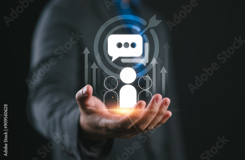 Businessman holding virtual target customer icon for customer focus group and Targeting customer concept. Digital marketing online, CRM, Data exchanges development and customer service.