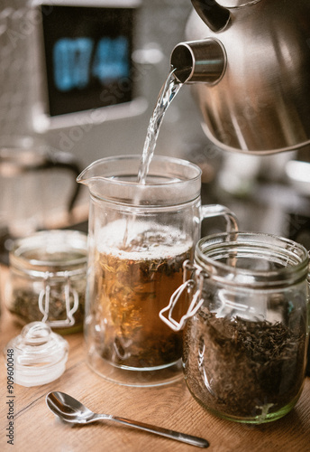 Tea preparation, hot water kettle. Home kitchen interior.