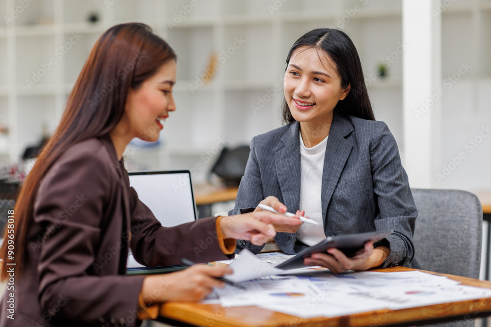 Banking business, finance and investment concept. Business asian women analyzing market data, financial graph report, economic growth, business strategy, planning and solution, risk management Banking business, finance and investment concept. Business asian women analyzing market data, financial graph report, economic growth, business strategy, planning and solution, risk management