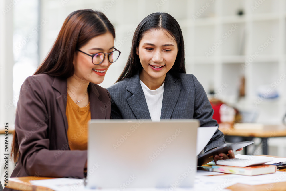Banking business, finance and investment concept. Business asian women analyzing market data, financial graph report, economic growth, business strategy, planning and solution, risk management Banking business, finance and investment concept. Business asian women analyzing market data, financial graph report, economic growth, business strategy, planning and solution, risk management