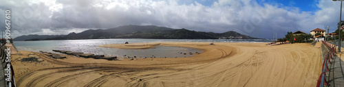 cleaning tasks on the beach of Laida, Vizcaya, opposite Mundaka,