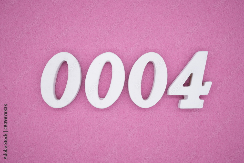 The numbers are made of white painted wood. Laying on the floor was pink paper. The numbers are made of white painted wood. Laying on the floor was pink paper.
