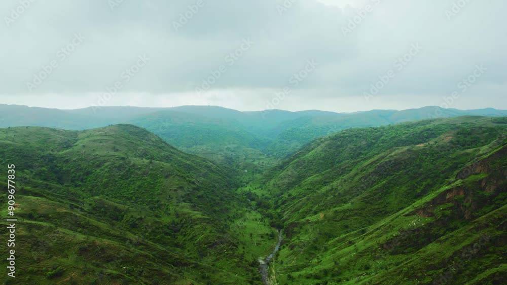 4K aerial view of Rayta Hills at Udaipur, Rajasthan, India. Green mountains and cloudy sky during monsoon season. Travel and holidays background. 4K aerial view of Rayta Hills at Udaipur, Rajasthan, India. Green mountains and cloudy sky during monsoon season. Travel and holidays background.