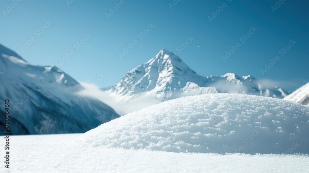 Obraz premium Winter and snowy landscapes Snow covered mountains under a clear blue sky reflecting serene beauty.