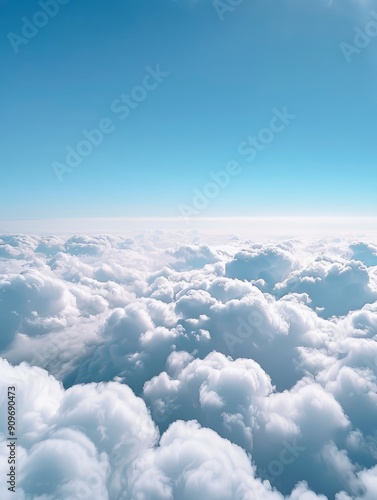 A view of a whispy blue sky above and a bed of gentle clouds below with generative ai