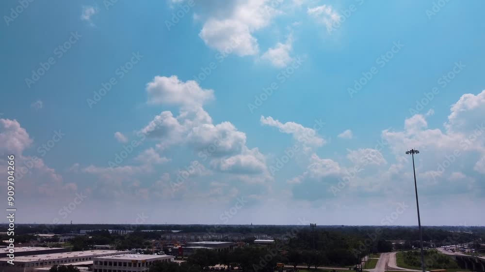 An aerial view of a blue sky, on a party cloudy day