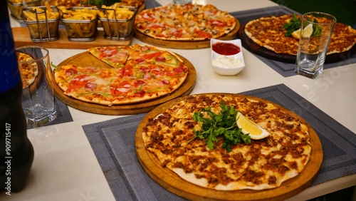 Assortment of Pizzas on a Tabletop