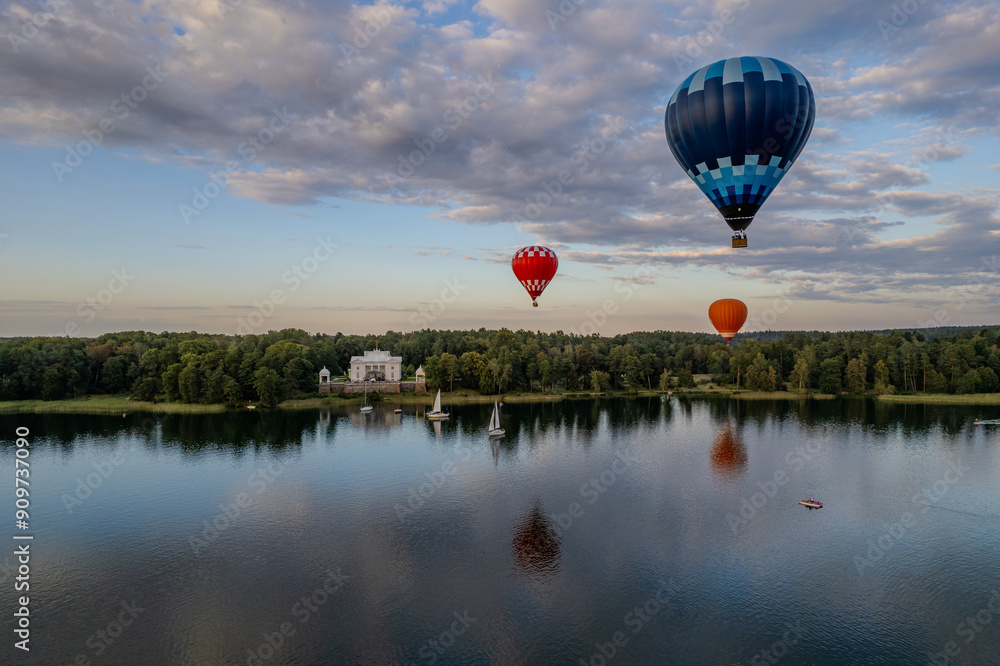 Fototapeta premium Aerial summer sunny view of hot air balloon over Galve lake in Trakai, Uzutrakis, Lithuania