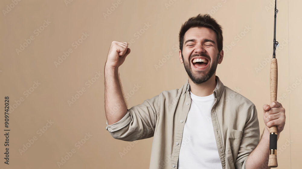 Man celebrating fishing success, happy fisherman holding rod, thrilled expression, fishing joy concept Man celebrating fishing success, happy fisherman holding rod, thrilled expression, fishing joy concept
