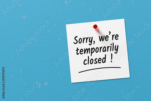 The message sorry we are temporarily closed written on a note paper photo