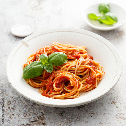 Spaghetti with tomato sauce and basil