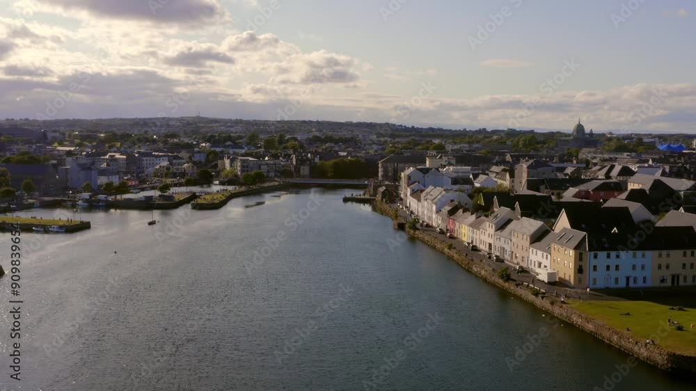 Aerial parallax of colourful sunny Galway city shot from River Corrib's mouth. Aerial parallax of colourful sunny Galway city shot from River Corrib's mouth.