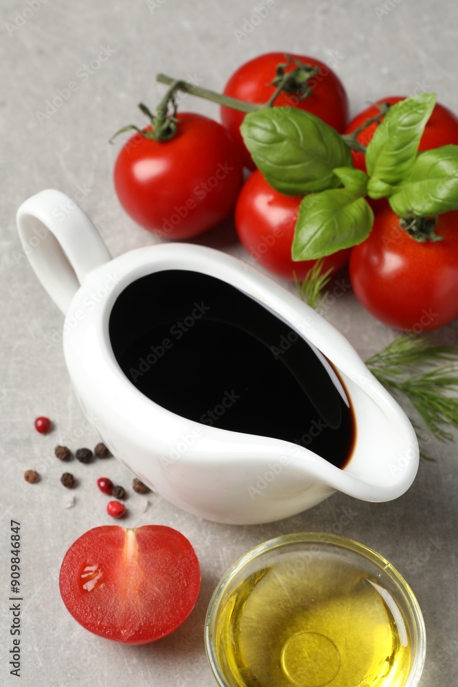 Balsamic vinegar, oil and other products on light grey table Balsamic vinegar, oil and other products on light grey table