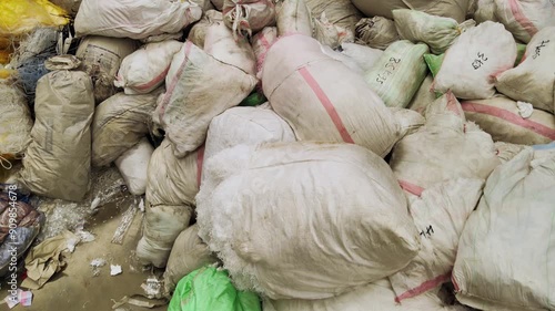  A stark depiction of overflowing garbage bags, highlighting the environmental impact of consumerism and the urgent need for responsible waste management.  photo