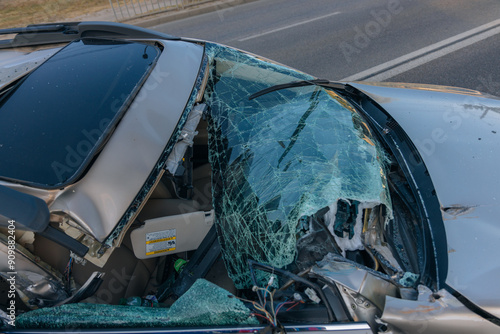 There was a collision of cars on the highway. Serious accident. Road accidents on the road. Broken windshield. The car flew under the trailer of a truck. Traffic jam. Insurance case on the road