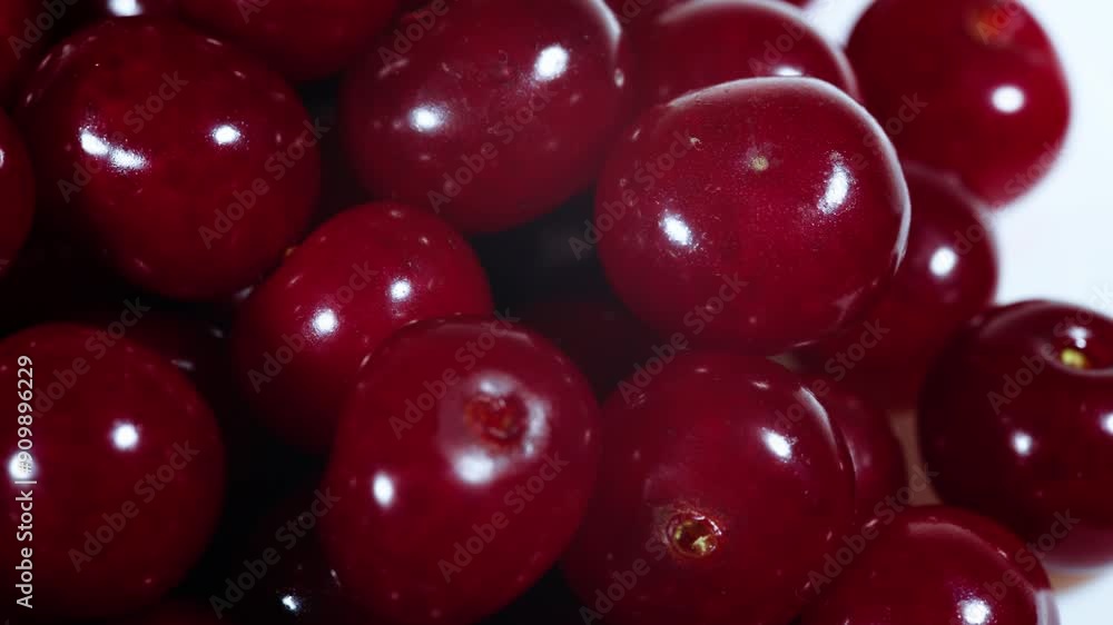 Ripe red cherries on plate isolated on white background. Ripe red cherries on plate isolated on white background.