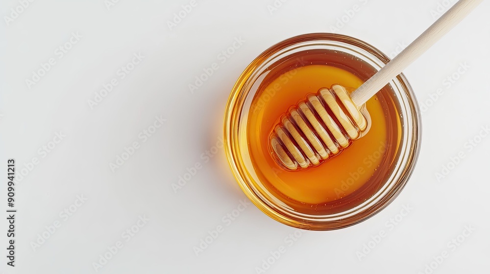 Top-down view of a glass bowl filled with honey and a honey dipper, isolated on a white background, highlighting the natural sweetness Top-down view of a glass bowl filled with honey and a honey dipper, isolated on a white background, highlighting the natural sweetness