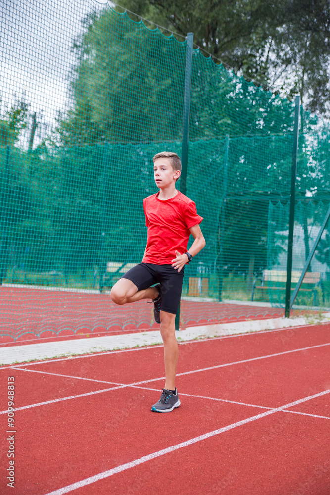 An athlete performs special running exercises at the stadium. An athlete performs special running exercises at the stadium.
