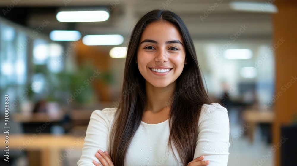Young smiling latin girl college student or teacher looking at camera ...