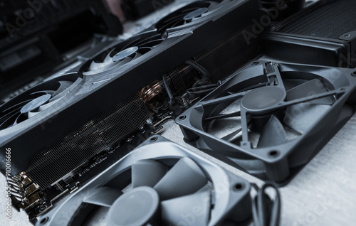 Computer Hardware Components Including Graphic Cards and Cooling Fans on a Workspace