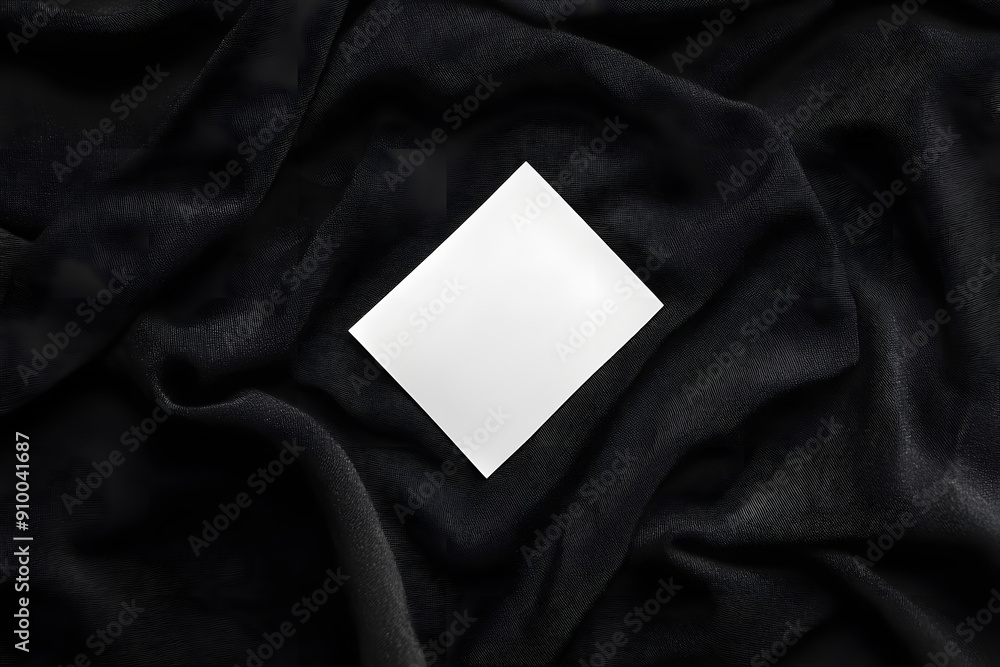 Blank White Laundry Care Label on Black Shirt Fabric Texture Blank White Laundry Care Label on Black Shirt Fabric Texture
