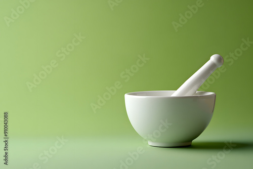 White Mortar and Pestle Isolated on Green Background