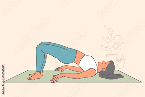 Woman does pilates on yoga mat, showing flexibility and feeling better through stretching