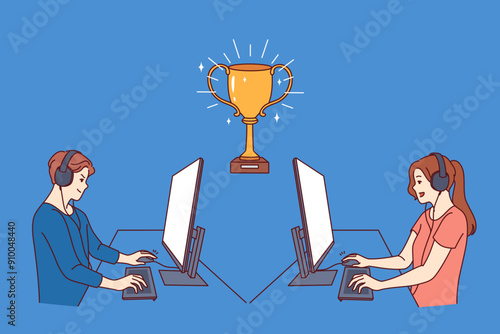 Gamers participate in esports video game tournament, sitting at tables with computers near gold cup. Guy and girl gamers compete to control virtual characters in shooters or RPG quests