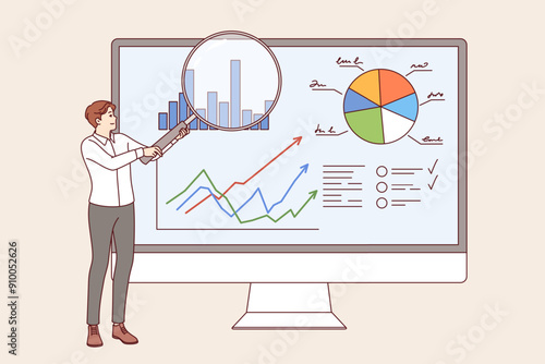 Man business analyst demonstrates charts in CRM system, standing near large computer monitor. Manager uses CRM to maintain statistics and track KPI of corporate department employees