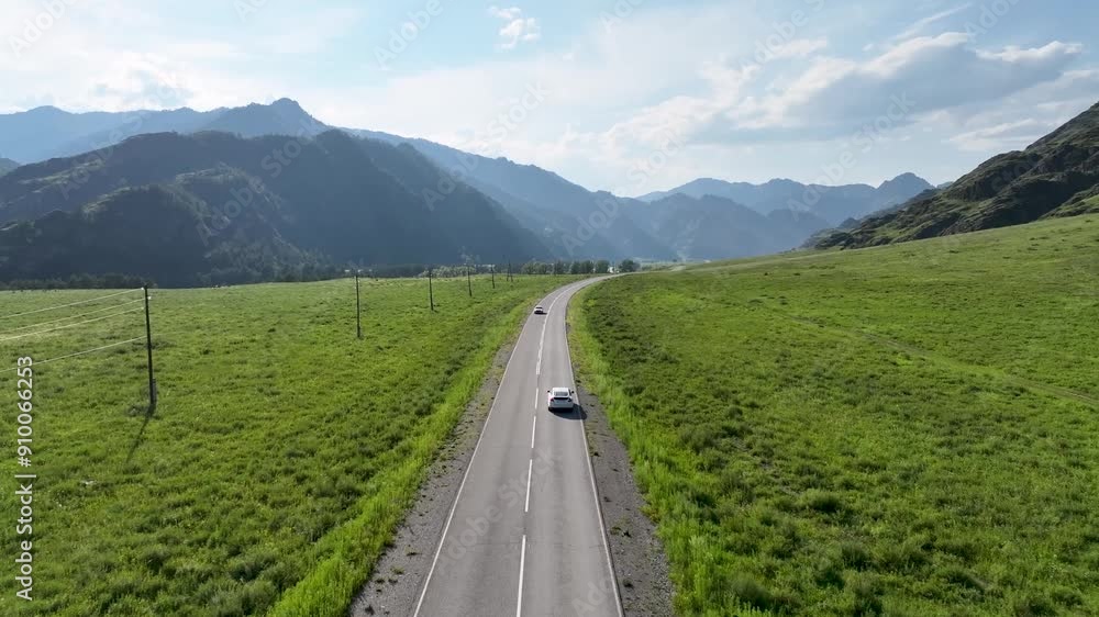aerial view of a car on a road in the intermountain valley of Altai aerial view of a car on a road in the intermountain valley of Altai