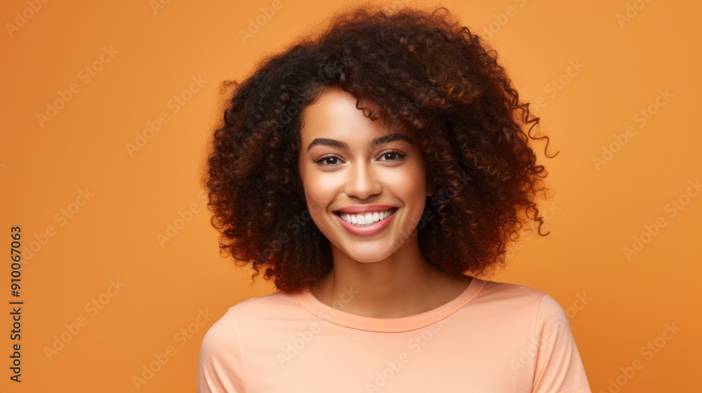 Smiling young black woman in casual attire against a clean background Smiling young black woman in casual attire against a clean background