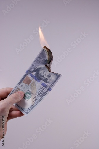 Cash is burning in gray background