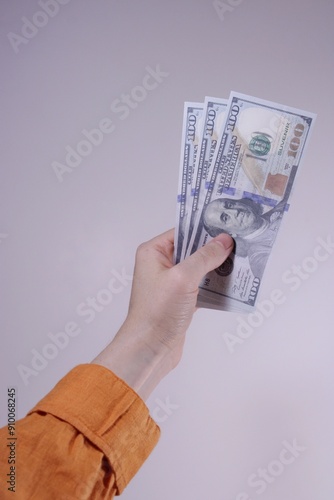 Hand with dollars minimalism concept