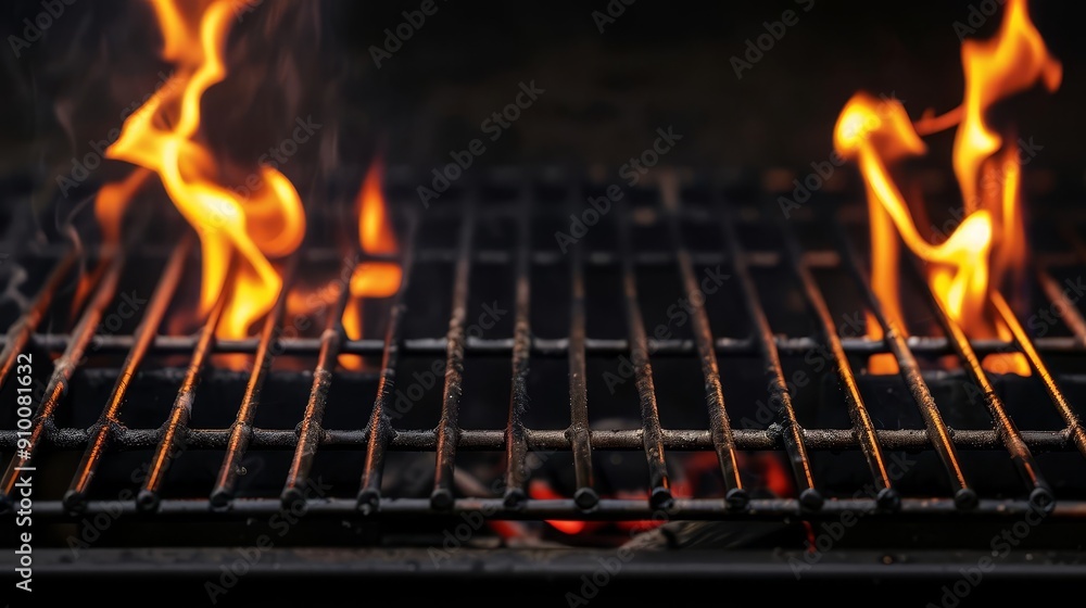 Close-up of a hot grill with flames burning underneath. Close-up of a hot grill with flames burning underneath.