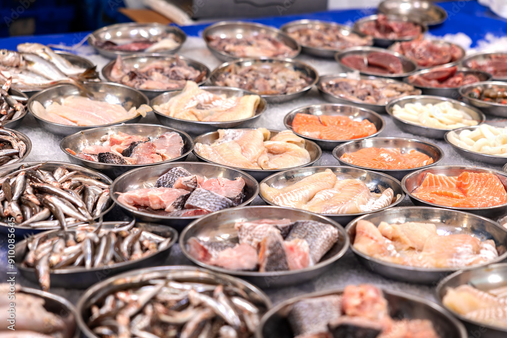 Different kind of seafod like cod, sprats, salmon, offerfed at the market in Rotterdam, Netherlands. Seafood, healthy, market trader, for cooking or frying, fish from the sea, market stall. Different kind of seafod like cod, sprats, salmon, offerfed at the market in Rotterdam, Netherlands. Seafood, healthy, market trader, for cooking or frying, fish from the sea, market stall.