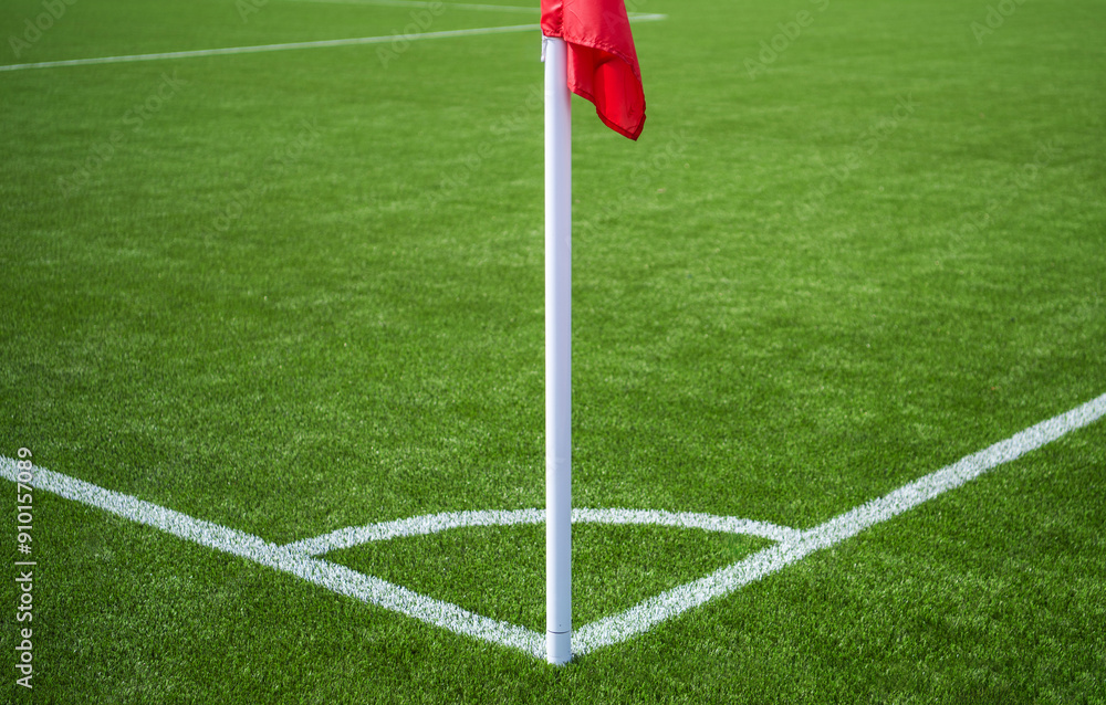 Fototapeta premium Corner Flag On A Green Soccer Field During Daytime