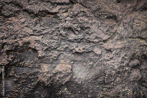 Empty black brown stone wall on rock for abstract background and texture. beautiful patterns, space for work, banner,seamless wallpaper, close up.