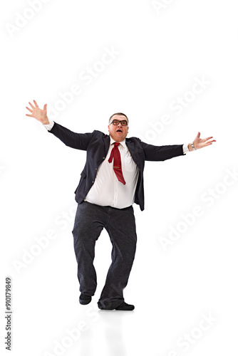 Catching new opportunities. Full-length of emotional fat businessman in black suit and glasses, spreading hands with emotive face isolated on white background. Concept of business, achievement