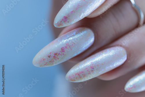 beautiful female hands with long nails light white manicure photo