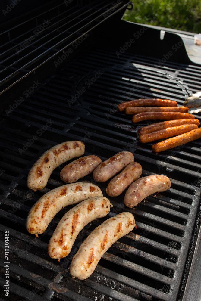 Grilling sausages on a barbecue grill. Selective focus. Grilling sausages on a barbecue grill. Selective focus.