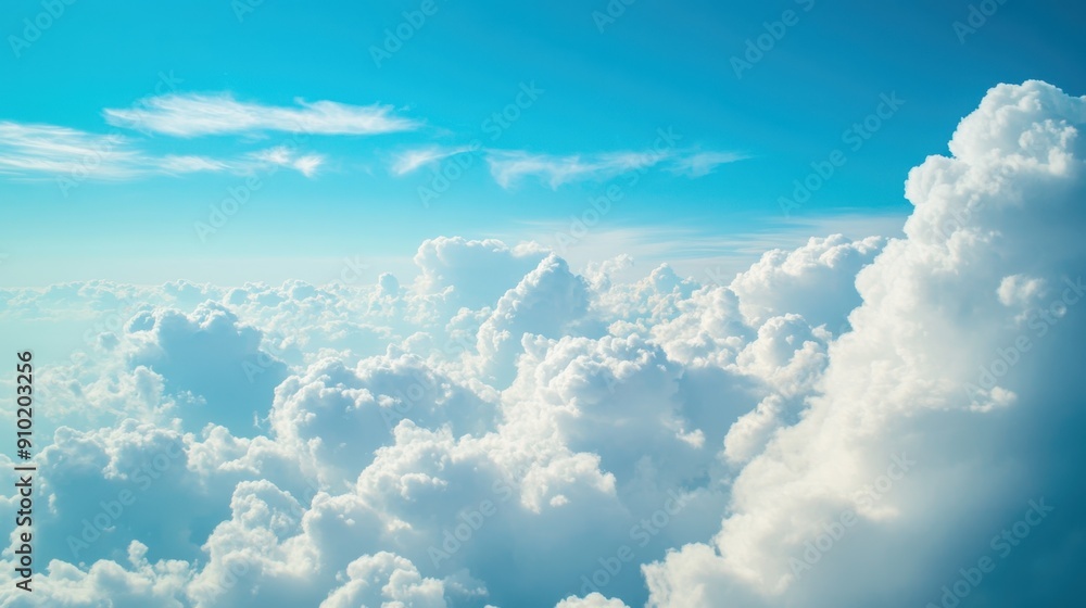 Serene blue sky with fluffy white clouds scattered throughout, creating a beautiful and colorful natural background Serene blue sky with fluffy white clouds scattered throughout, creating a beautiful and colorful natural background