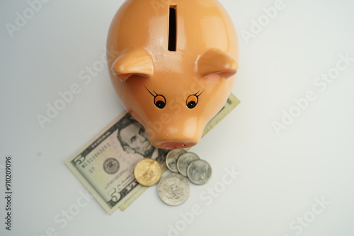 Wallpaper Mural top view of several dollar bills and coins in a piggy bank Torontodigital.ca