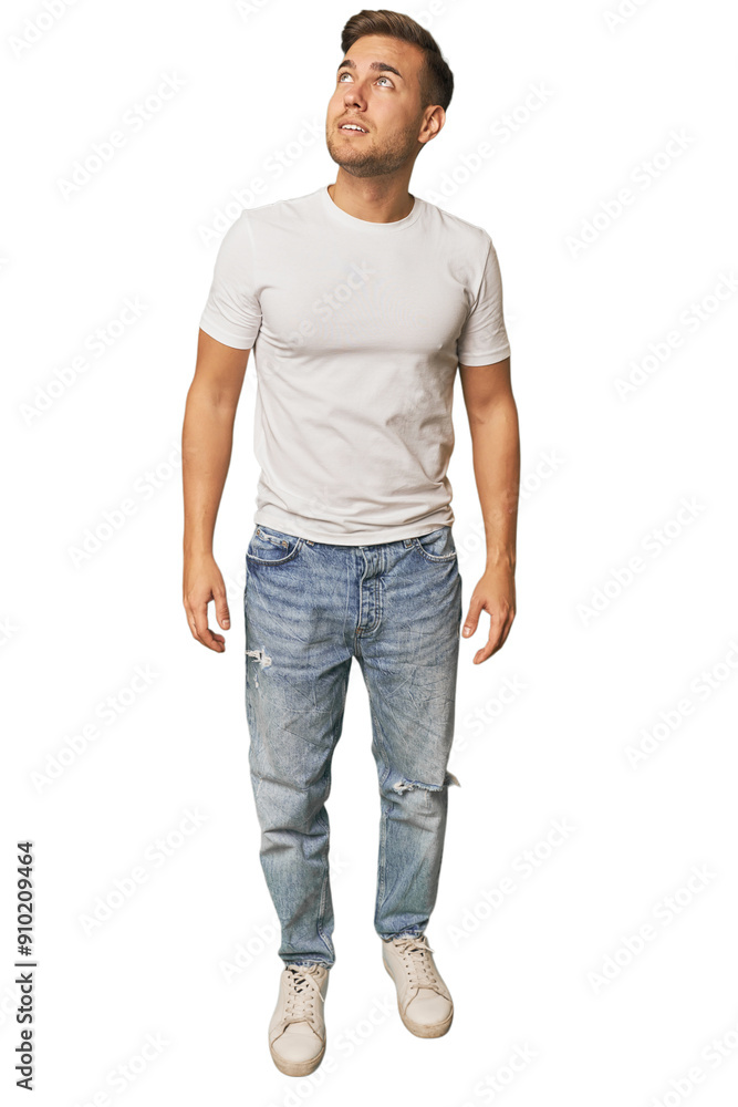 Full body shot of a young Caucasian man in a studio setting Full body shot of a young Caucasian man in a studio setting