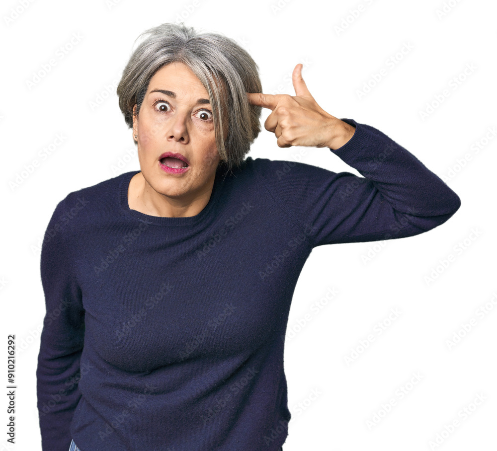 Caucasian mid-age female on studio background showing a disappointment gesture with forefinger. Caucasian mid-age female on studio background showing a disappointment gesture with forefinger.