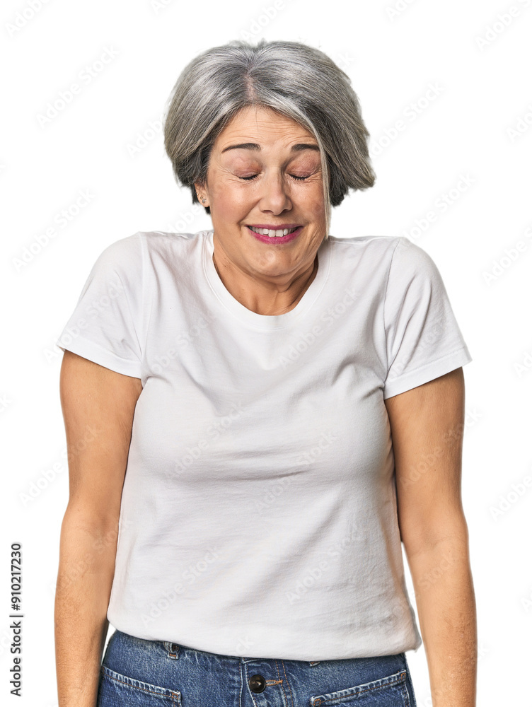 Caucasian mid-age female on studio background laughs and closes eyes, feels relaxed and happy. Caucasian mid-age female on studio background laughs and closes eyes, feels relaxed and happy.