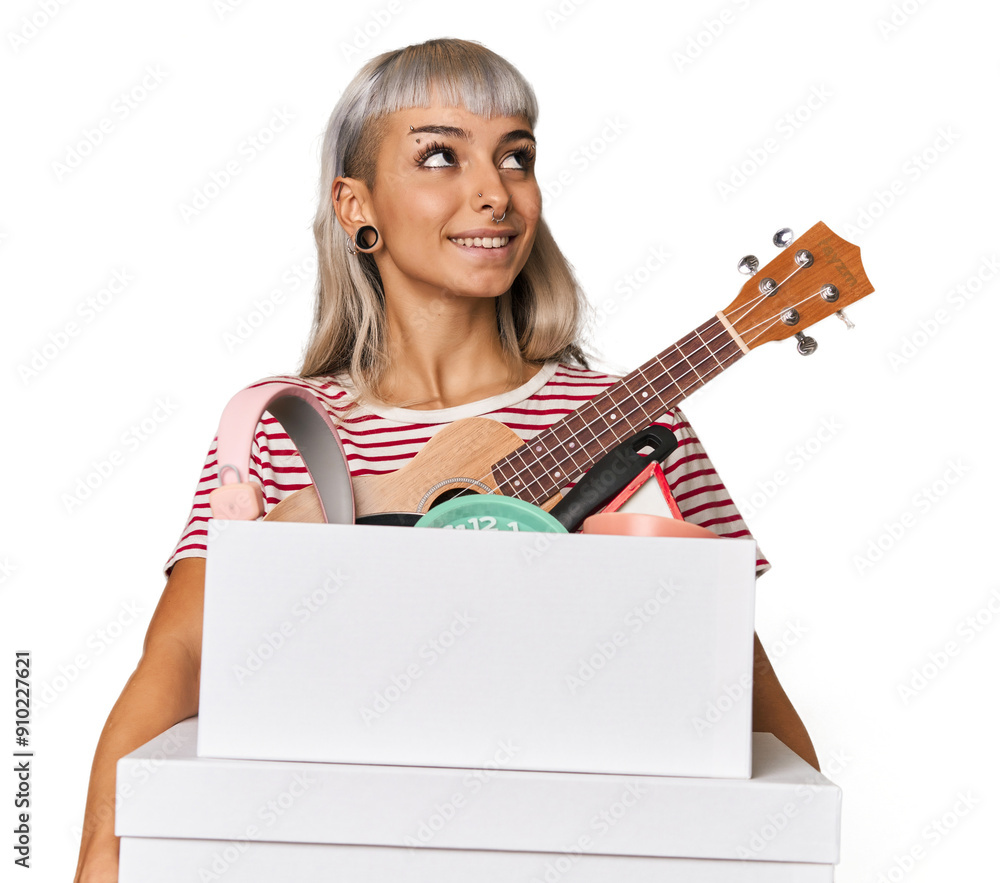 Young Caucasian woman holding a moving box Young Caucasian woman holding a moving box