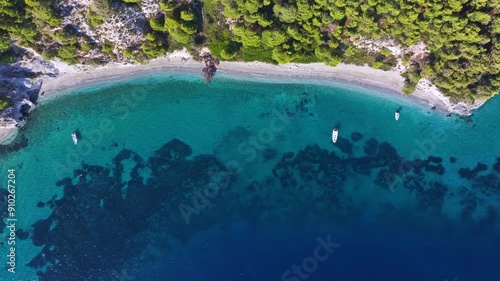 Aerial view of the beautiful beaches and coast of Skopelos island, Sporades, Greece, with lush pine forest and turquoise sea photo